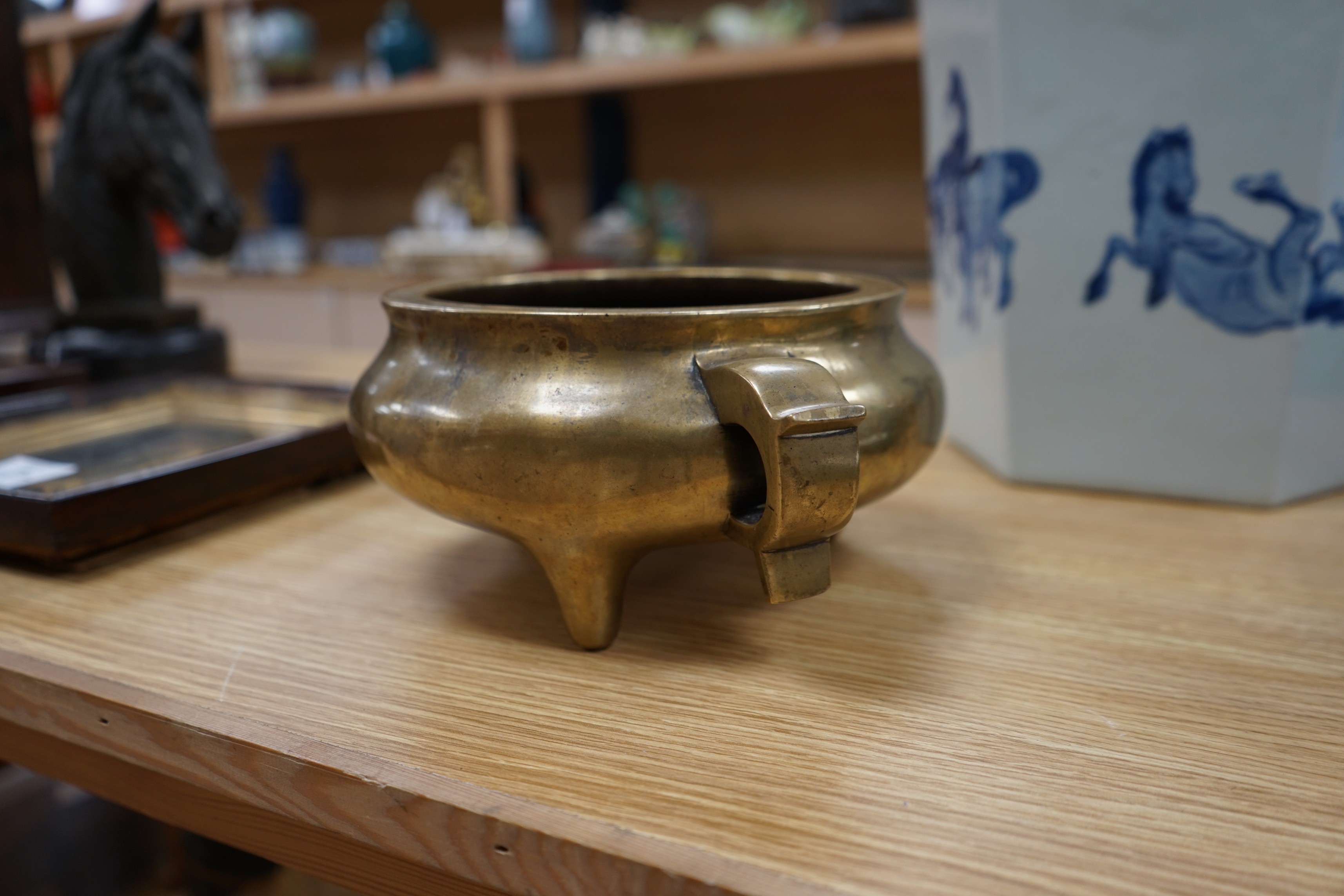 A large Chinese bronze censer, ding, 18th century, with sixteen character Xuande mark, 29cm wide